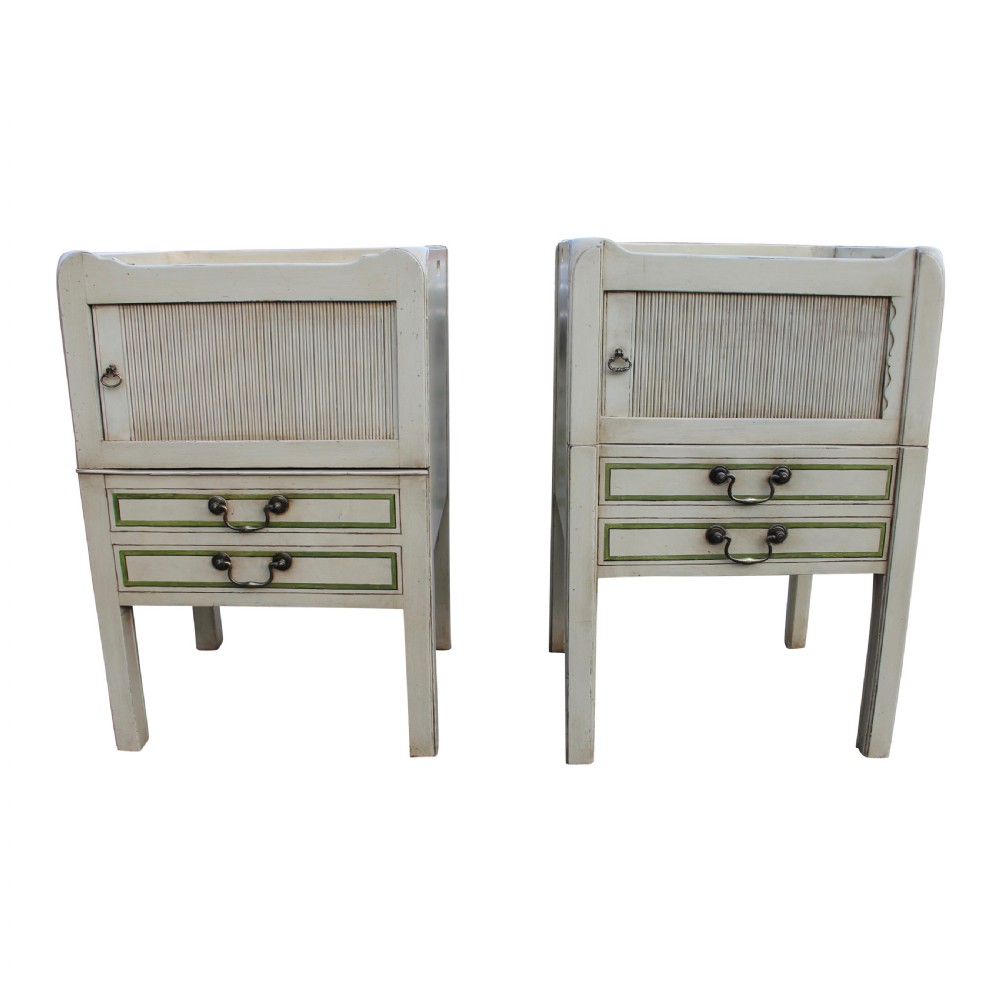 A matched pair of cream-painted Georgian bedside cupboards featuring tambour front doors above two small drawers with green painted trim and brass pulls. View II