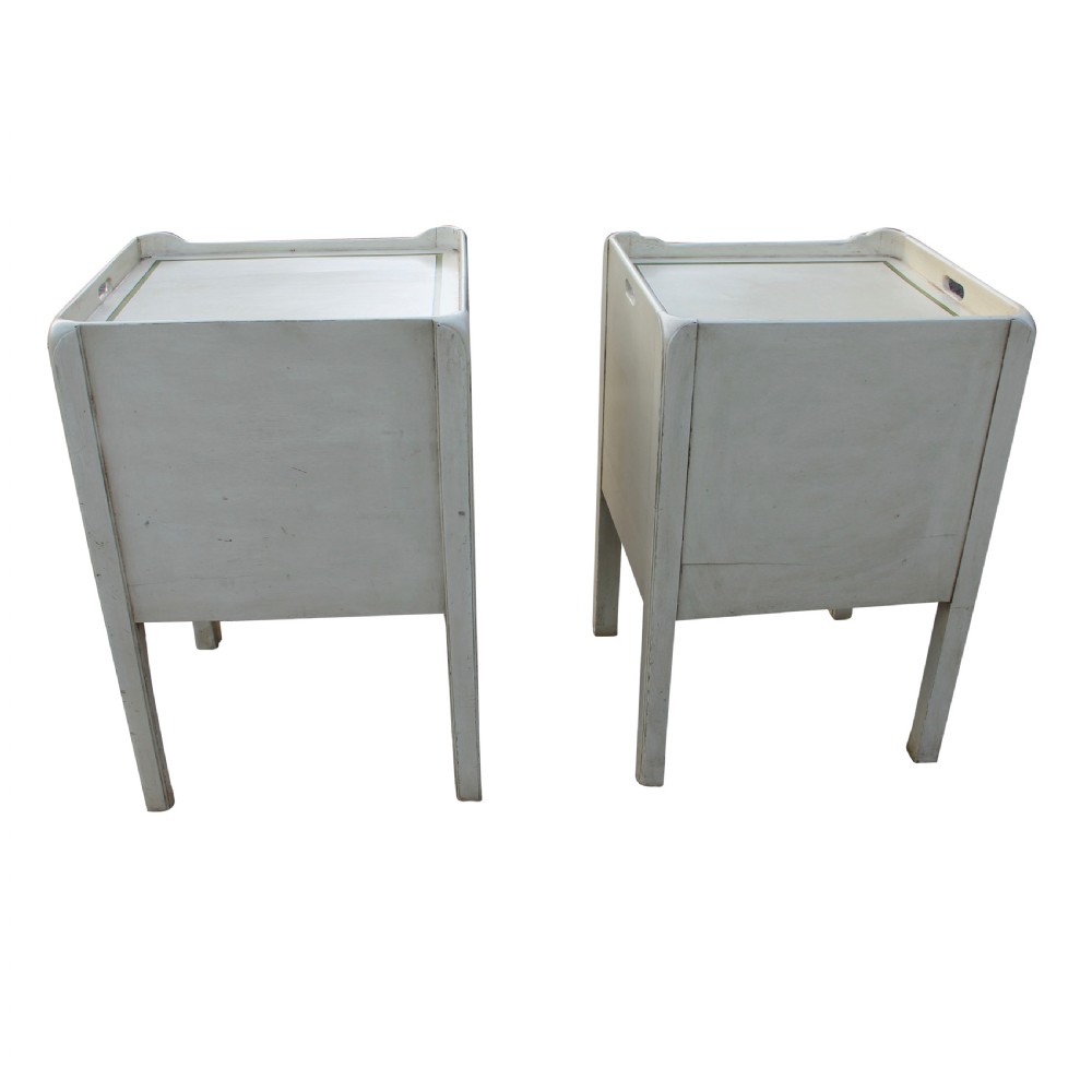 A matched pair of cream-painted Georgian bedside cupboards featuring tambour front doors above two small drawers with green painted trim and brass pulls. View III