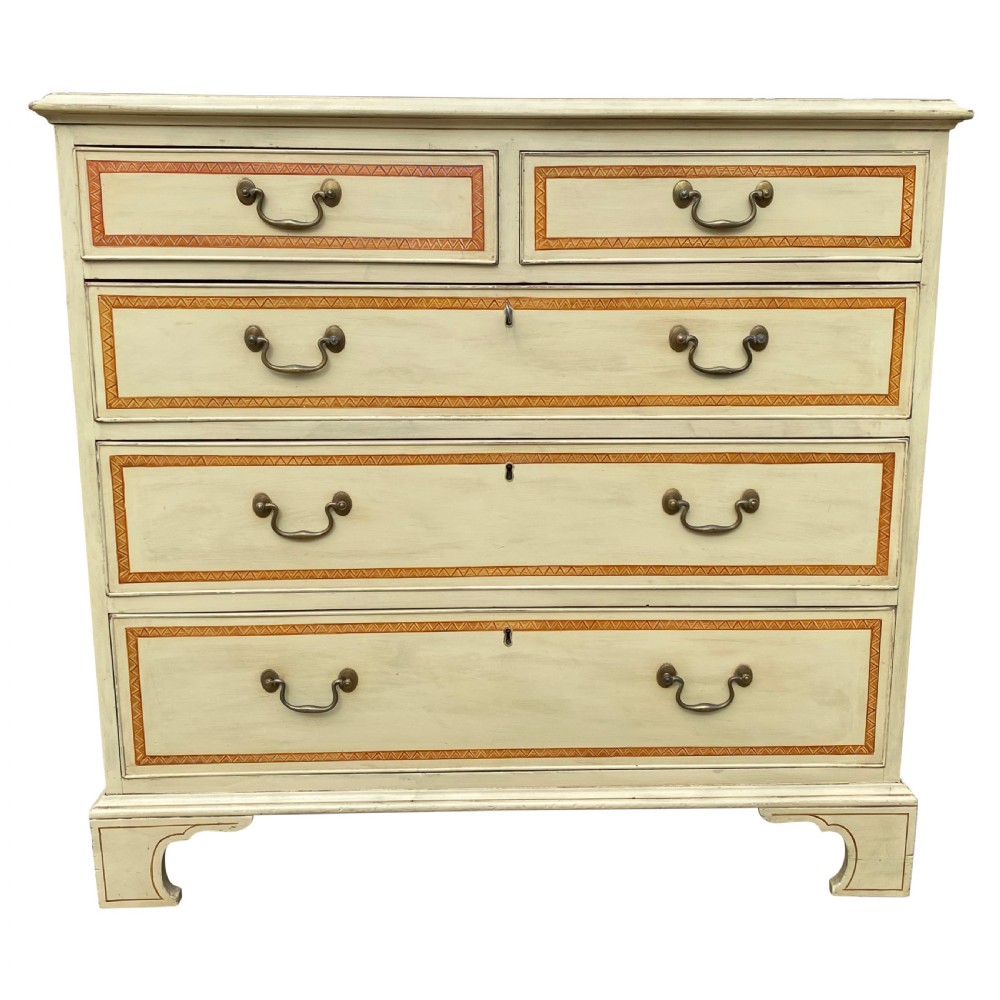 A cream-painted Georgian chest of drawers featuring five horizontal drawers with decorative borders and brass swing handles.