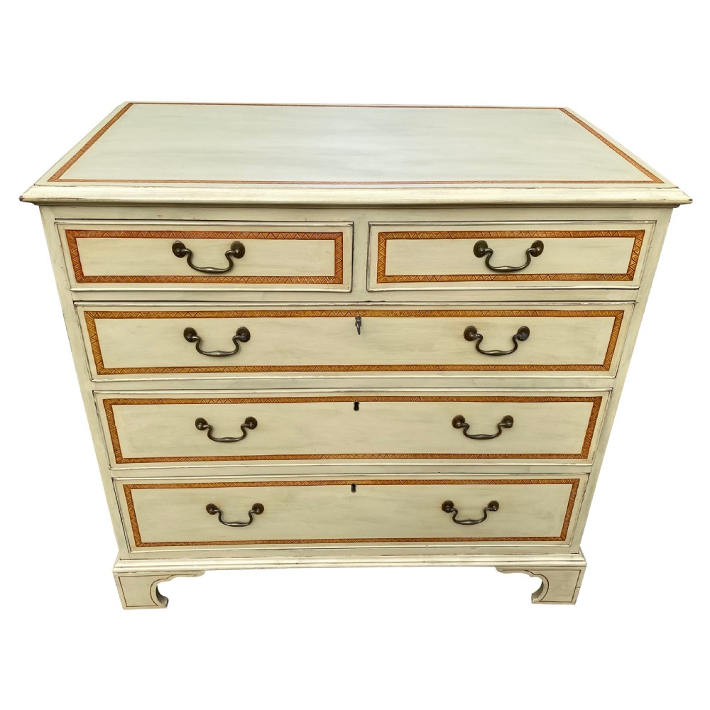 A cream-painted Georgian chest of drawers featuring five horizontal drawers with decorative borders and brass swing handles. View III