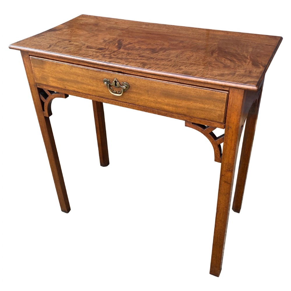 A rectangular solid mahogany side table featuring a single central drawer with a brass drop handle and fretwork brackets beneath the top. View II