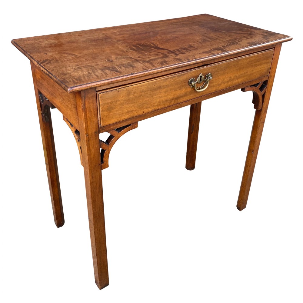 A rectangular solid mahogany side table featuring a single central drawer with a brass drop handle and fretwork brackets beneath the top. View III