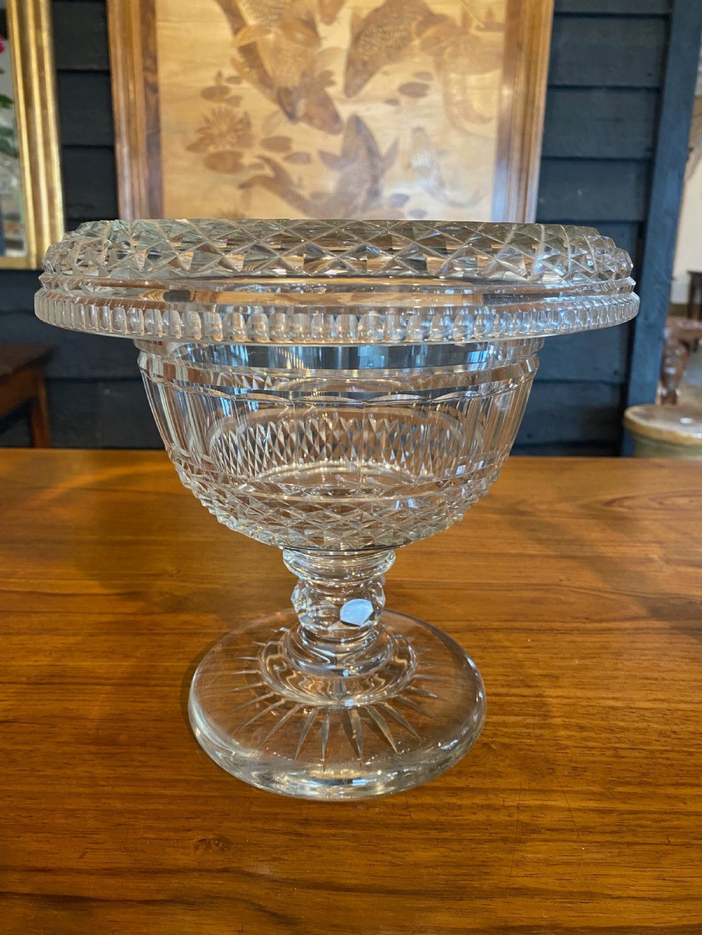 A nineteenth-century clear cut crystal pedestal bowl with diamond geometric cutting and a starburst faceted circular base.