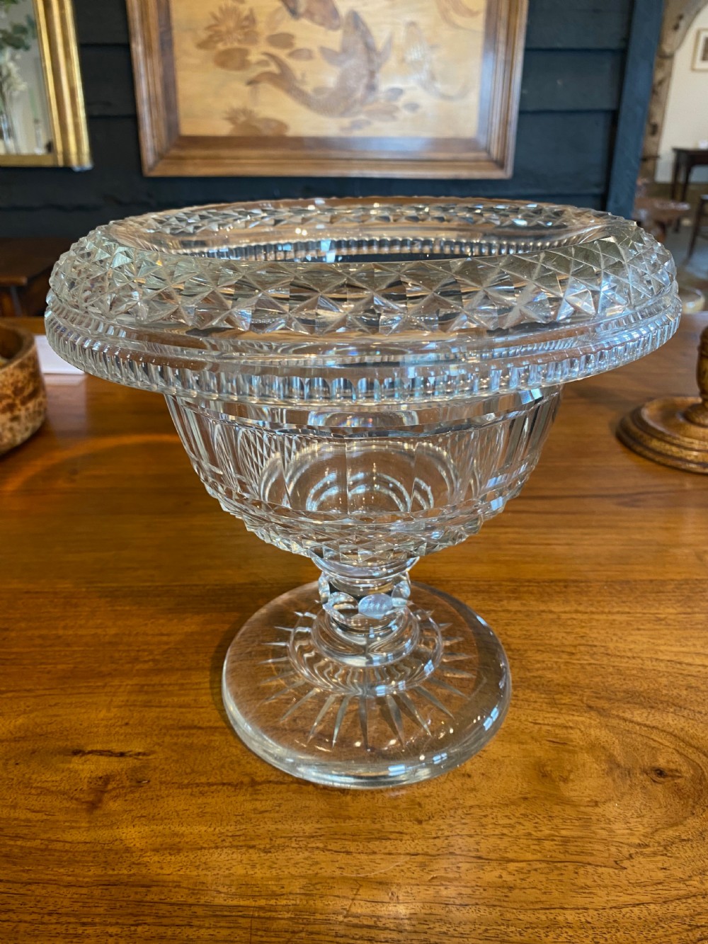 A nineteenth-century clear cut crystal pedestal bowl with diamond geometric cutting and a starburst faceted circular base. View III