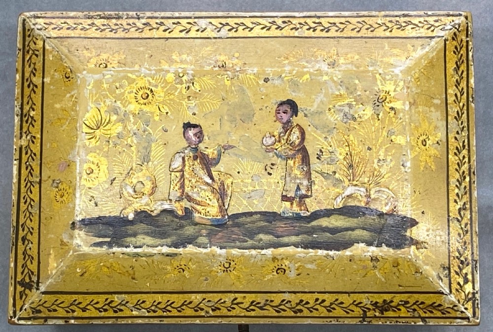 A rectangular yellow Georgian lacquer box adorned with hand-painted chinoiserie figures on the hinged lid and elevated on small ball feet. View VII