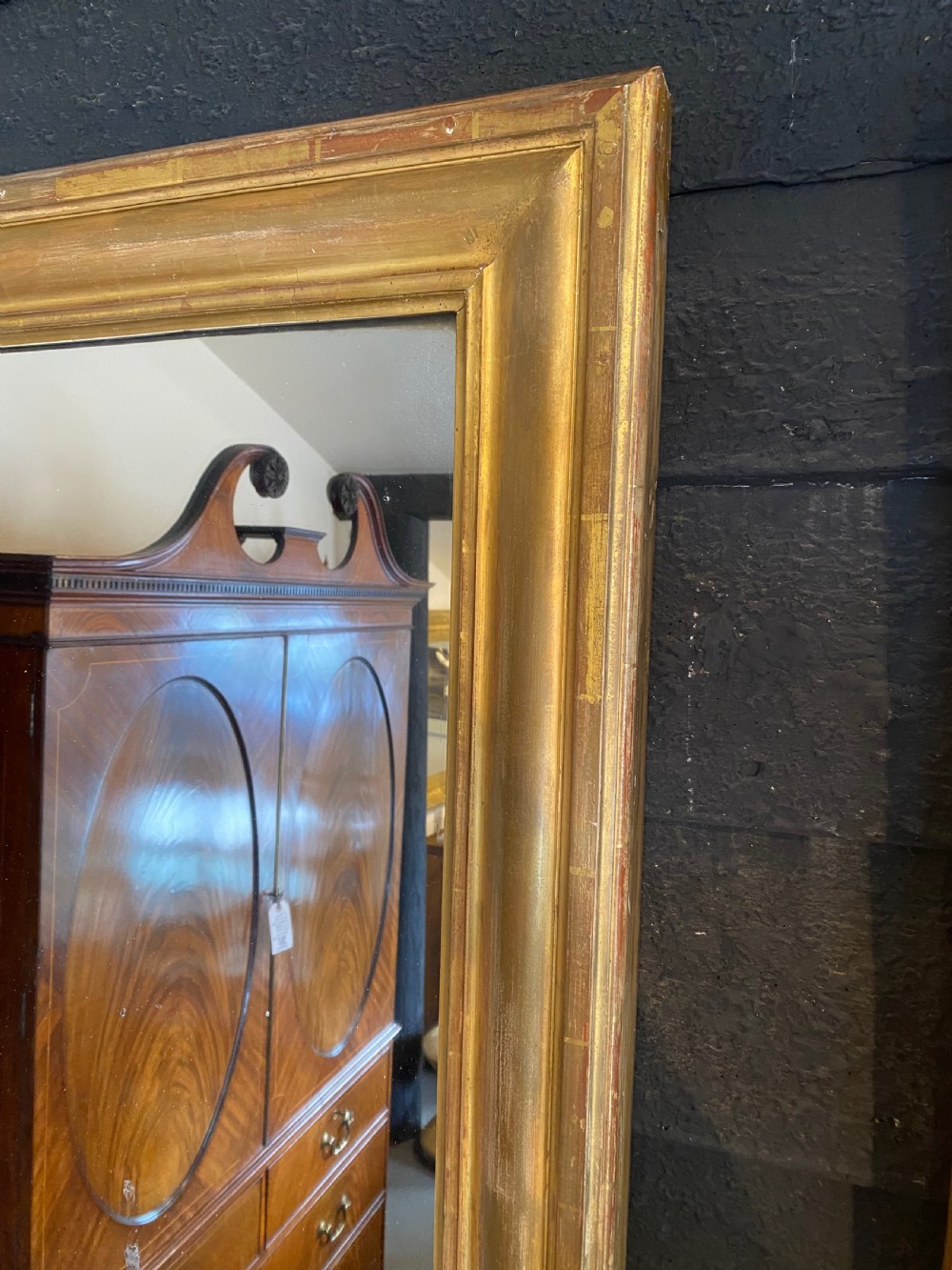 A large rectangular early 19th-century wall mirror featuring a moulded gold leaf giltwood frame and clear mirror plate. View II