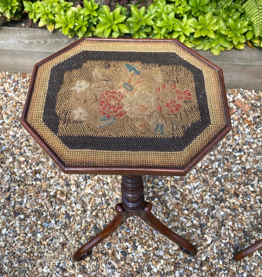 A pair of antique Georgian mahogany wine tables with octagonal needlework tops, ring-turned stems, and tripod bases with scroll feet. View III