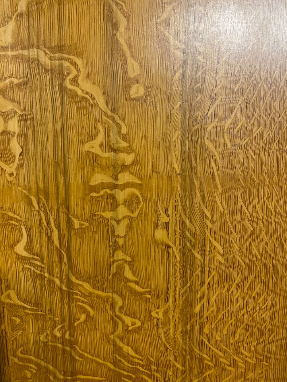 A nineteenth-century two-door wardrobe featuring a scumble faux oak grain paint finish, twin recessed panels, a stepped upper cornice, and brass keyhole fittings. View II