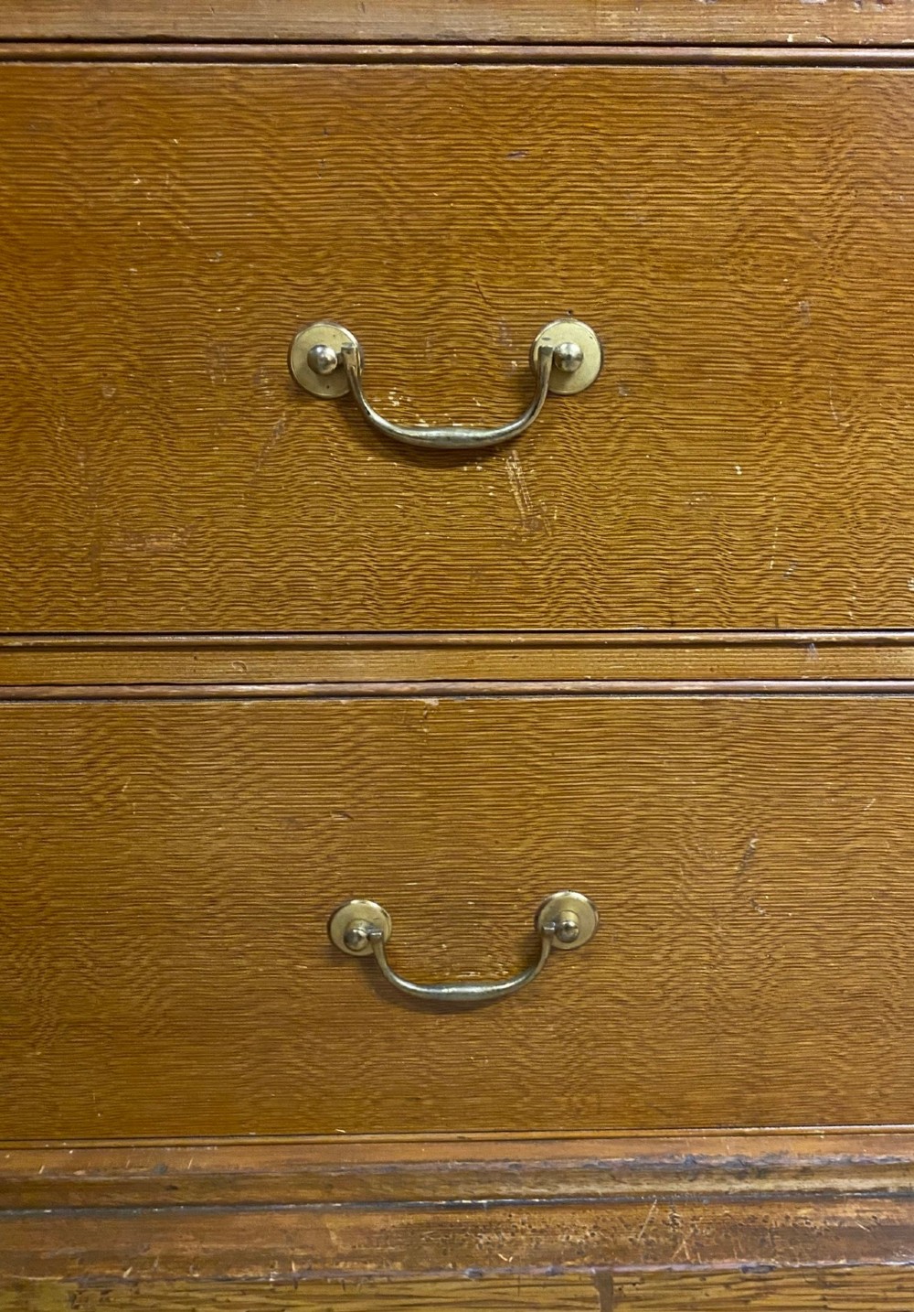 A nineteenth-century two-door wardrobe featuring a scumble faux oak grain paint finish, twin recessed panels, a stepped upper cornice, and brass keyhole fittings. View IV