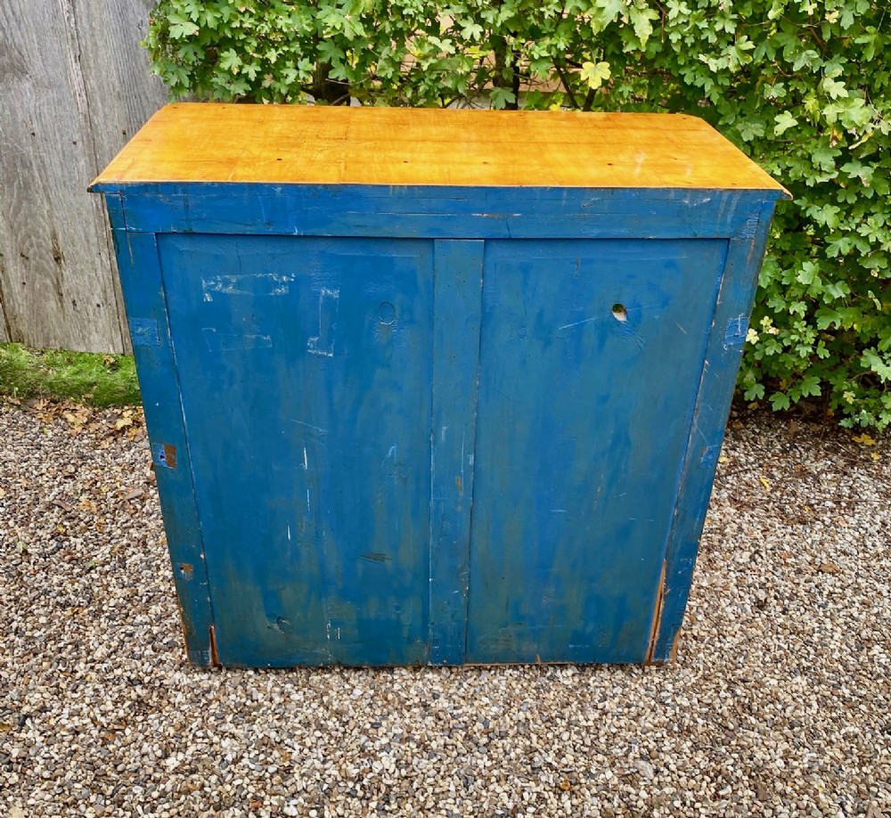A mid-19th-century Swedish satin birch chest featuring four straight drawers with central keyhole escutcheons. View IX