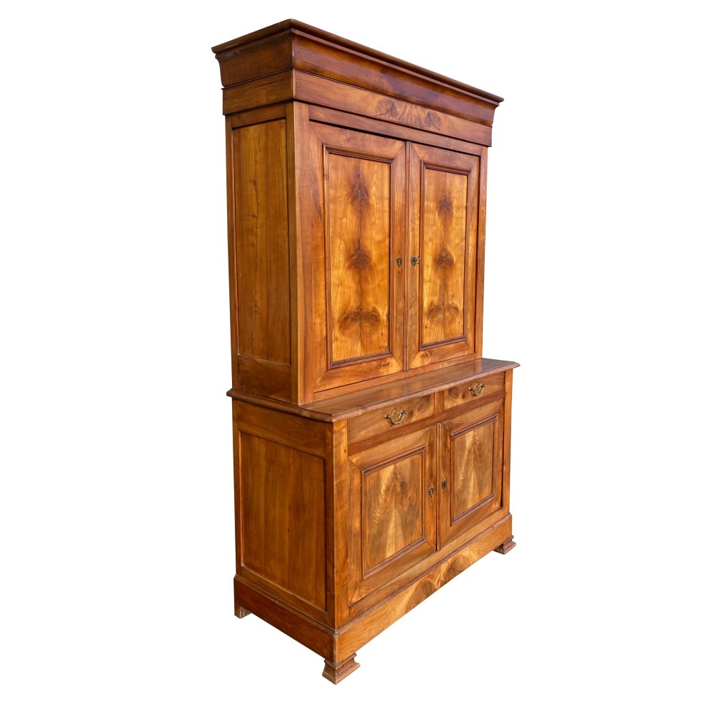 A 19th-century French two-part solid cherry wood housekeeper cupboard with double doors on the upper and lower sections and two central drawers. View V