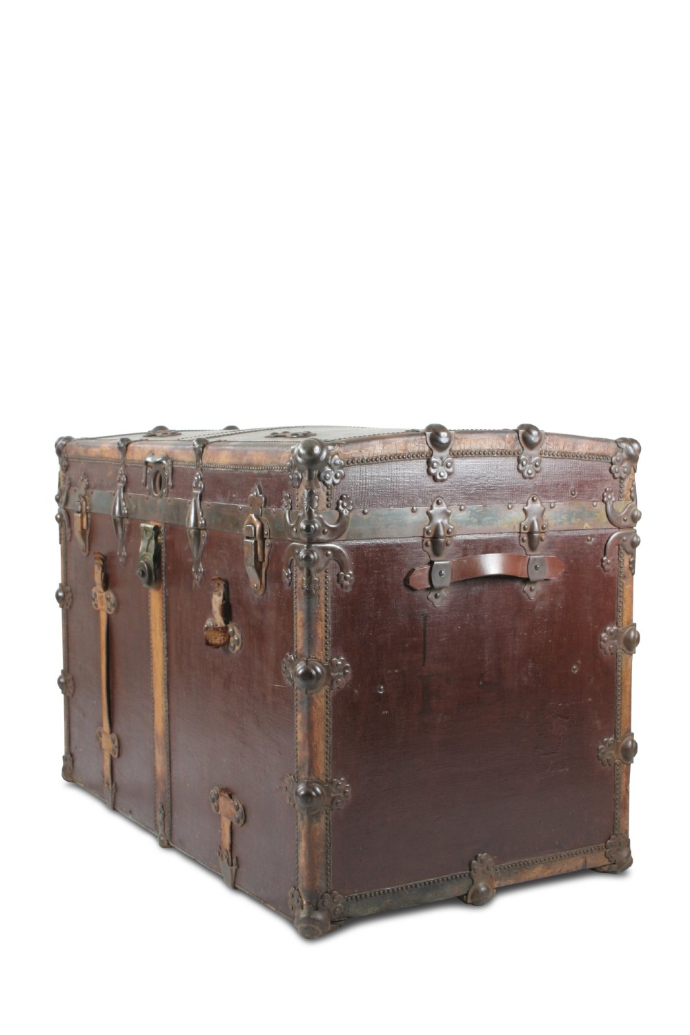 An antique French dark brown leather trunk with metal corner guards, riveted details, central latches, and vertical leather straps. View II