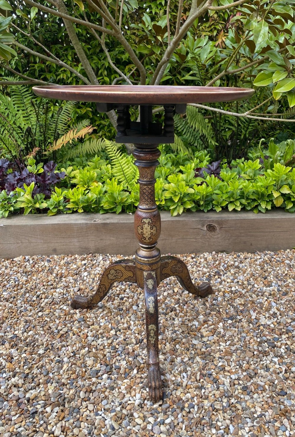 An Anglo-Indian tripod side table featuring an oval tray top supported by an intricately lacquered turned column and three cabriole legs. View II