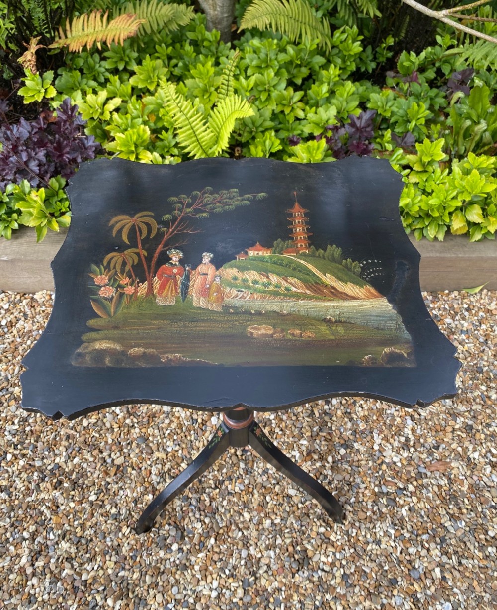 A black lacquered tripod side table featuring a shaped top decorated with a hand-painted Chinoiserie landscape scene resting on a turned column pedestal. View VI