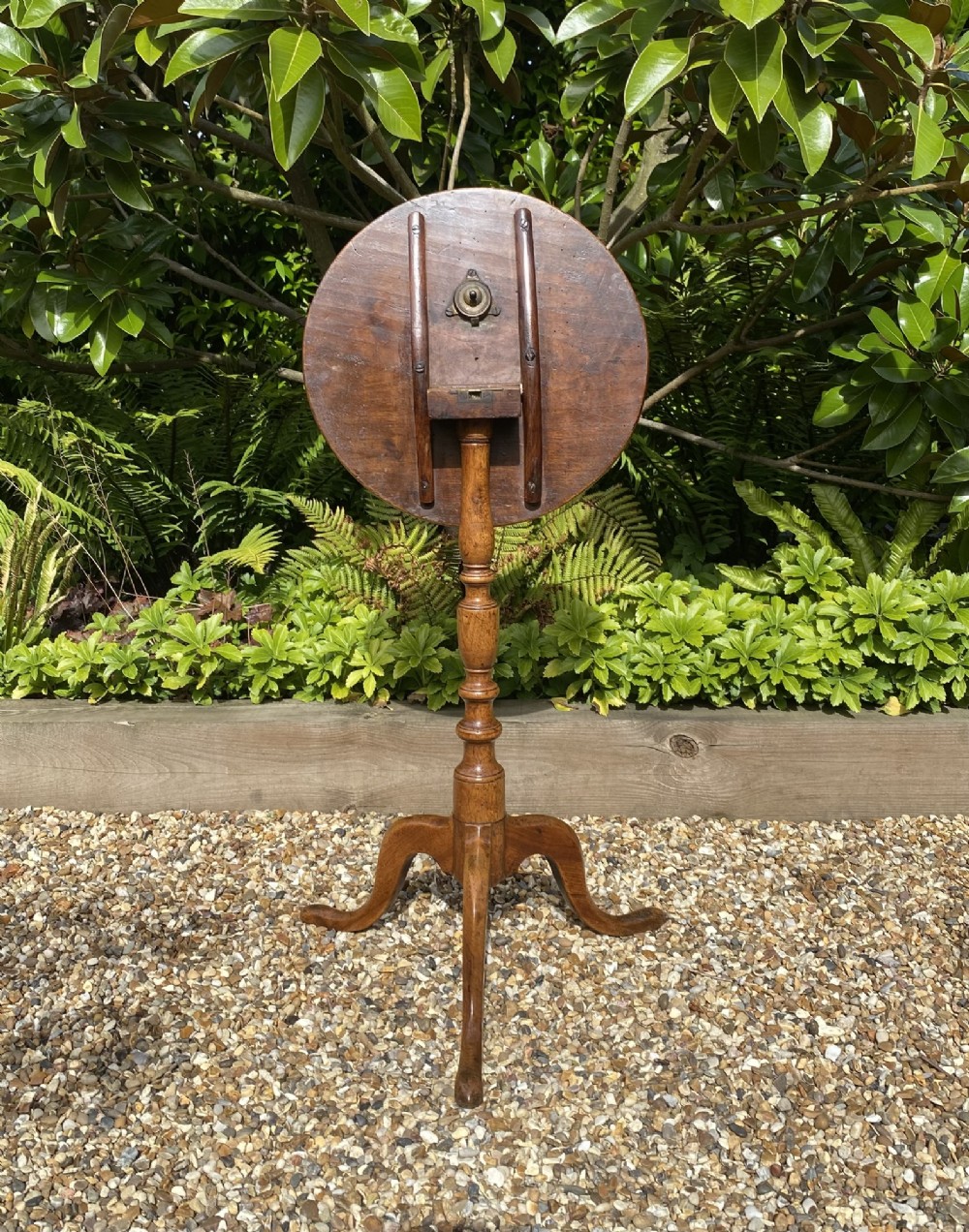 An 18th-century George II walnut wine table featuring a circular top, a baluster-turned central column, and a three-legged tripod base. View II