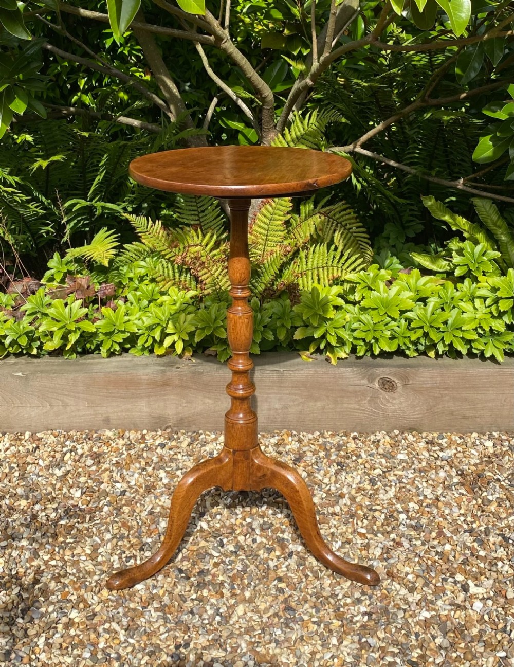 An 18th-century George II walnut wine table featuring a circular top, a baluster-turned central column, and a three-legged tripod base. View III