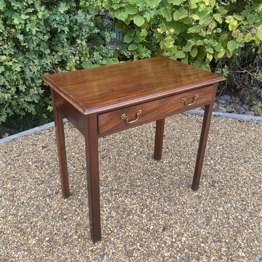 An 18th-century Georgian mahogany side table featuring a single drawer with two brass swan-neck handles and square legs. View II