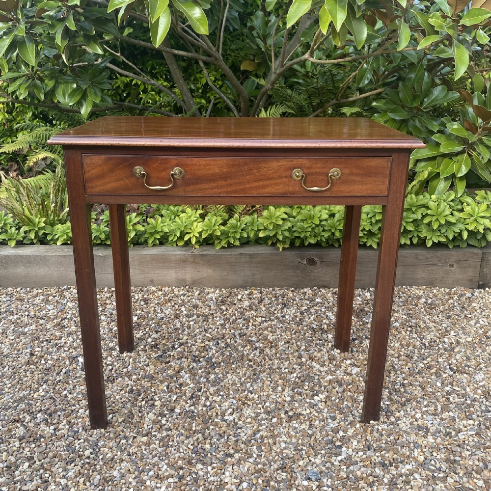 An 18th-century Georgian mahogany side table featuring a single drawer with two brass swan-neck handles and square legs. View III