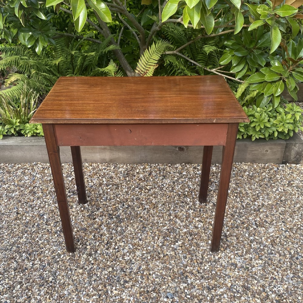 An 18th-century Georgian mahogany side table featuring a single drawer with two brass swan-neck handles and square legs. View IV