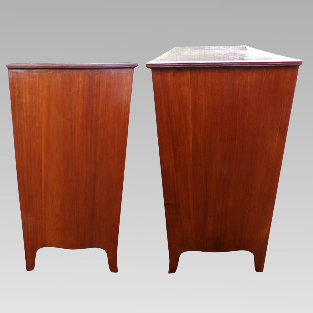 A Victorian mahogany chest of drawers featuring two short over three long drawers with satinwood crossbanding and oval brass handles. View III