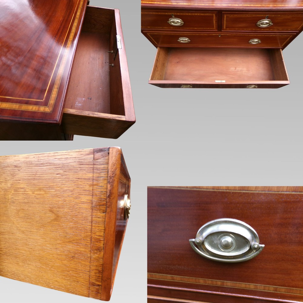 A Victorian mahogany chest of drawers featuring two short over three long drawers with satinwood crossbanding and oval brass handles. View IX
