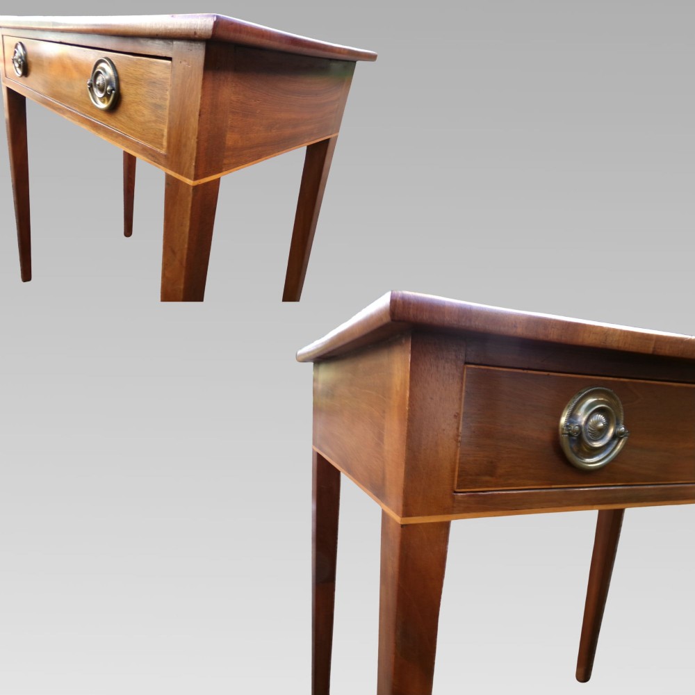 A George III mahogany side table with fine string inlay around the single drawer front and brass ring handles, raised on square tapered legs. View IX
