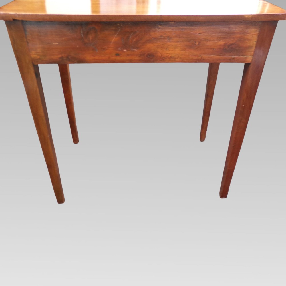 A George III mahogany side table with fine string inlay around the single drawer front and brass ring handles, raised on square tapered legs. View X