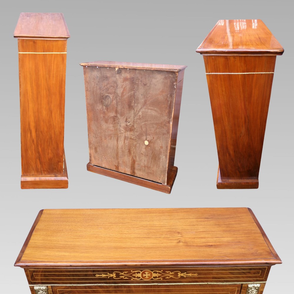 A nineteenth-century walnut veneer pier cabinet featuring floral marquetry inlay, gilt brass mounts, a single glazed door, and a red velvet lined interior. View III