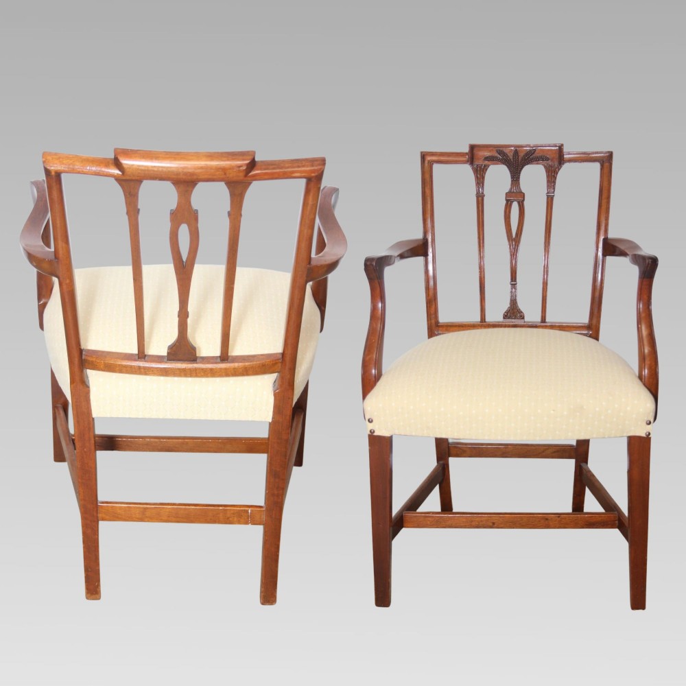 A set of six mahogany Hepplewhite style dining chairs with carved openwork back splats and light cream upholstered seats. View VII