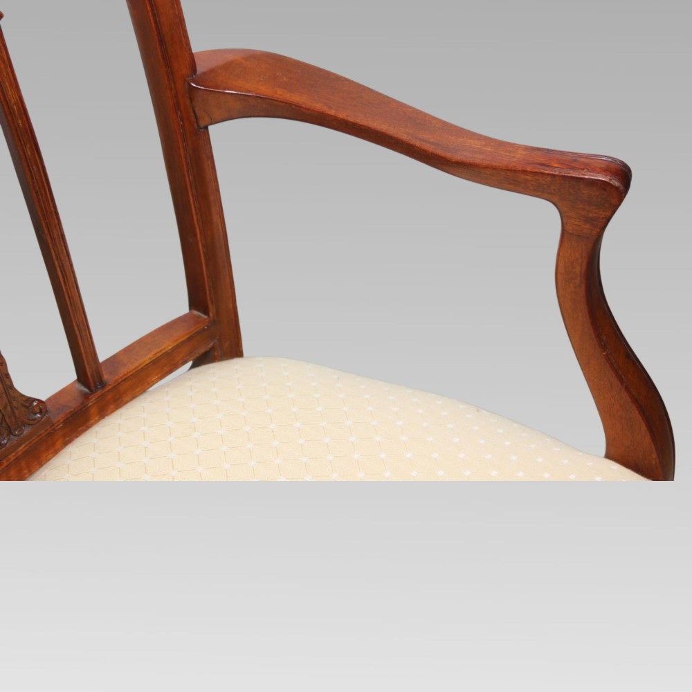 A set of six mahogany Hepplewhite style dining chairs with carved openwork back splats and light cream upholstered seats. View VIII