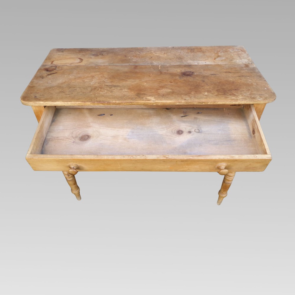 A 19th-century Victorian natural pine side table featuring a single wide drawer with wooden knob handles and slender turned legs. View IV