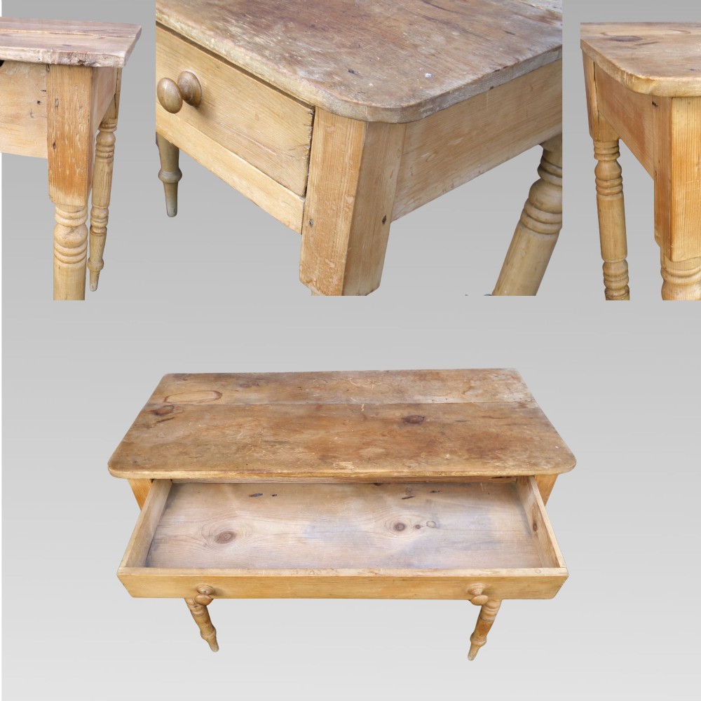 A 19th-century Victorian natural pine side table featuring a single wide drawer with wooden knob handles and slender turned legs. View VI