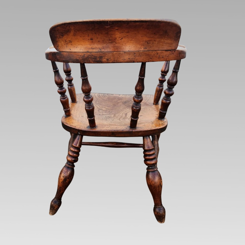 A nineteenth-century turned wood smokers bow armchair featuring a shaped elm seat and turned beech spindles. View IV