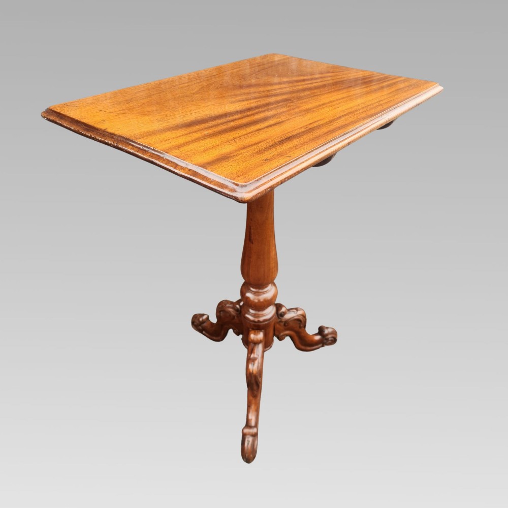 A 19th-century Victorian mahogany side table featuring a rectangular tilt top supported by a turned baluster column and carved tripod legs. View II