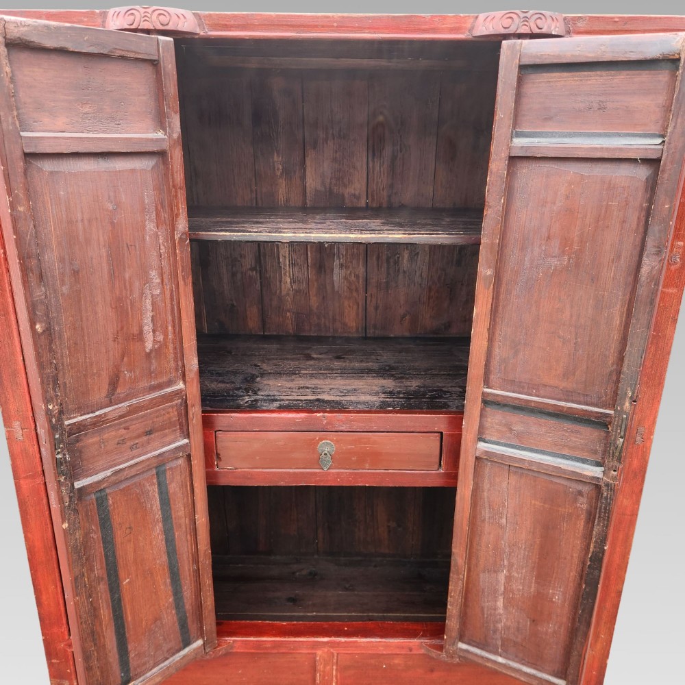 A tall red lacquered Chinese cabinet featuring four vertical doors decorated with hand-painted figurative scenes and floral motifs. View III