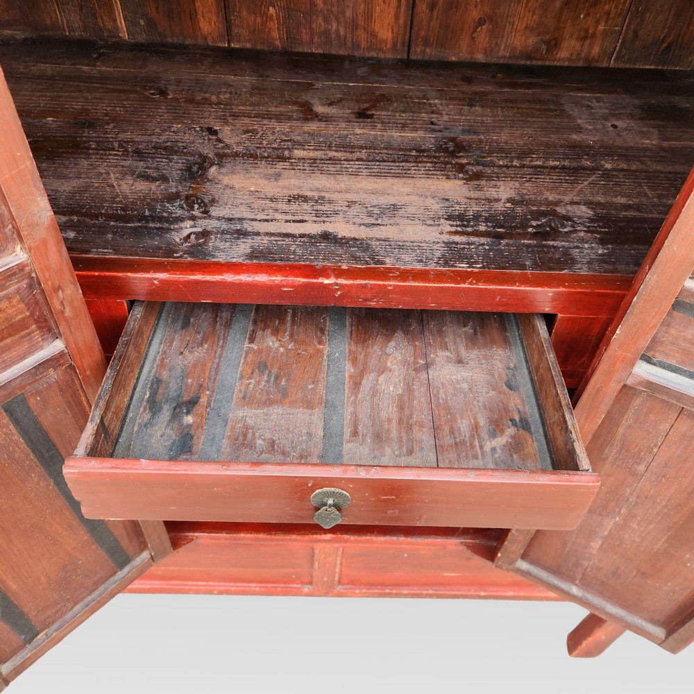 A tall red lacquered Chinese cabinet featuring four vertical doors decorated with hand-painted figurative scenes and floral motifs. View VII