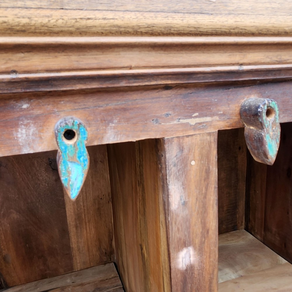 A rustic three-door reclaimed teak sideboard featuring hand-carved floral pilasters, iron ring handles, and metal stud accents. View VIII