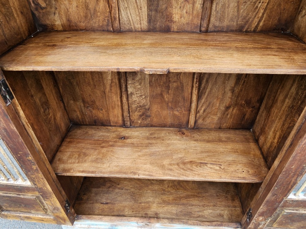 A tall reclaimed teak cupboard featuring two double doors with upper vertical metal slats and a distressed blue and raw timber finish. View VI