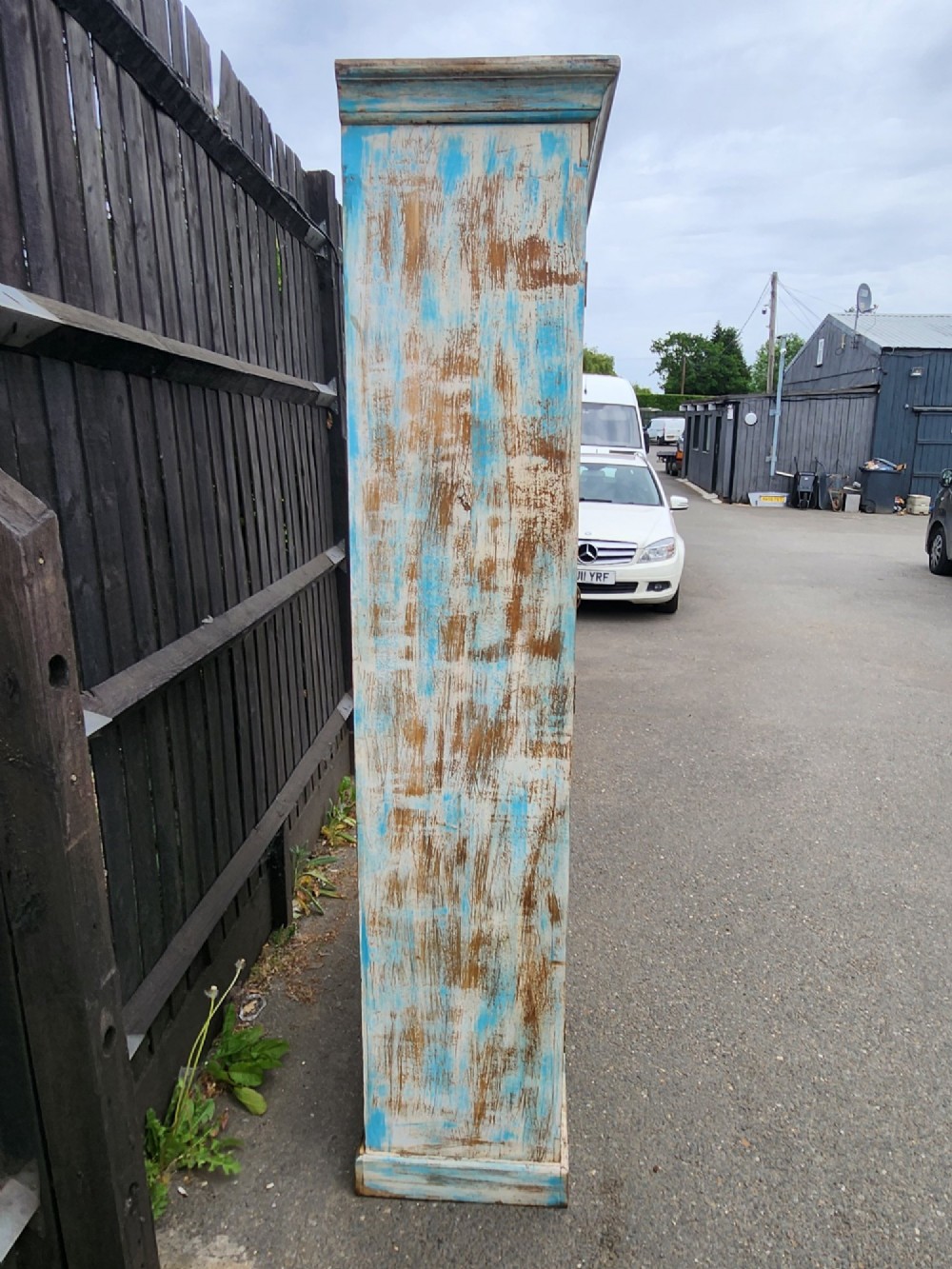 A tall reclaimed teak cupboard featuring two double doors with upper vertical metal slats and a distressed blue and raw timber finish. View XII
