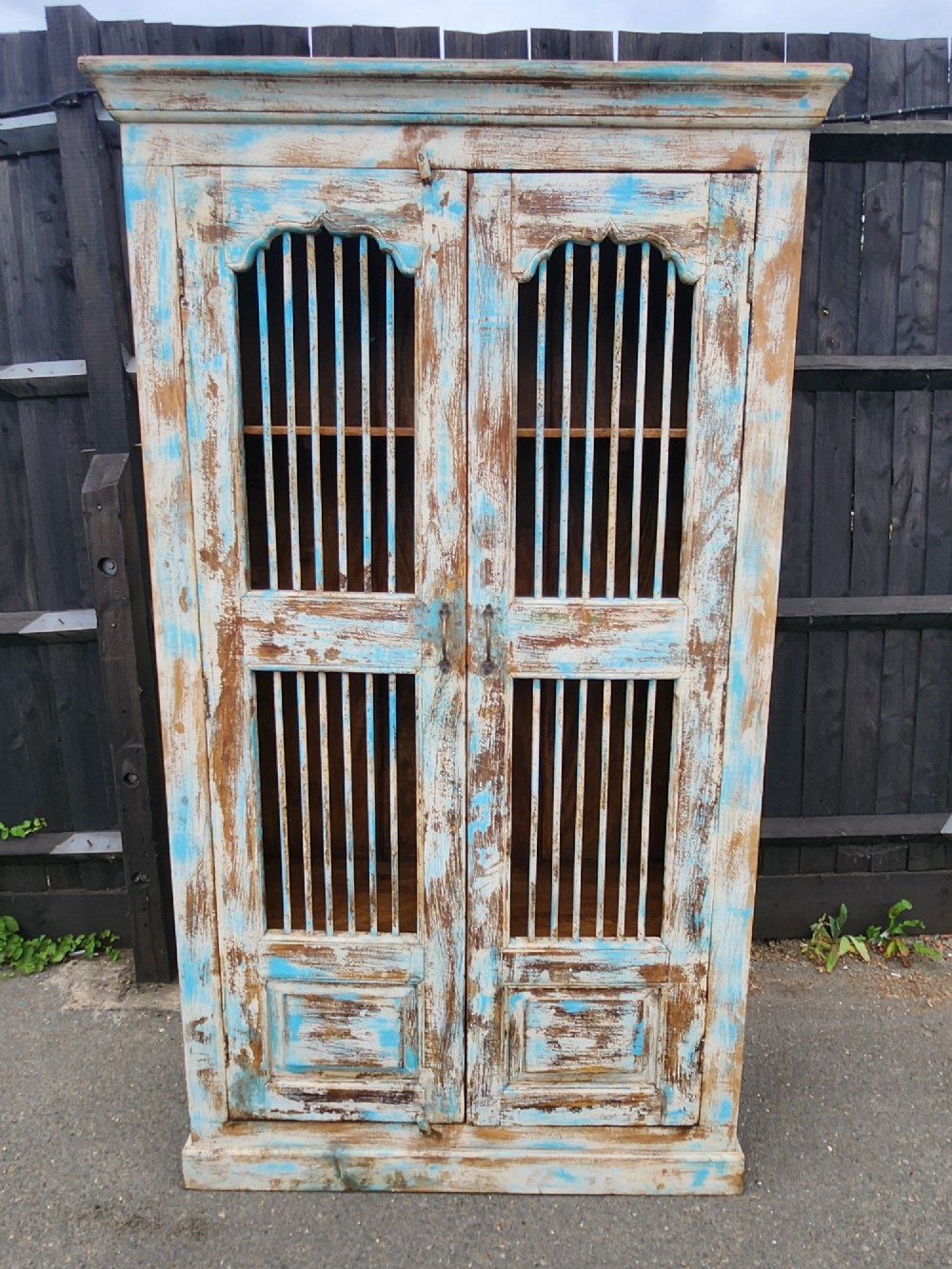 A tall reclaimed teak cupboard featuring two double doors with upper vertical metal slats and a distressed blue and raw timber finish. View XIII