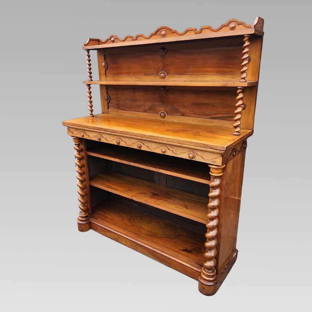A late Victorian warm brown walnut open buffet sideboard featuring barley twist columns, two upper display shelves, and open base shelving. View II