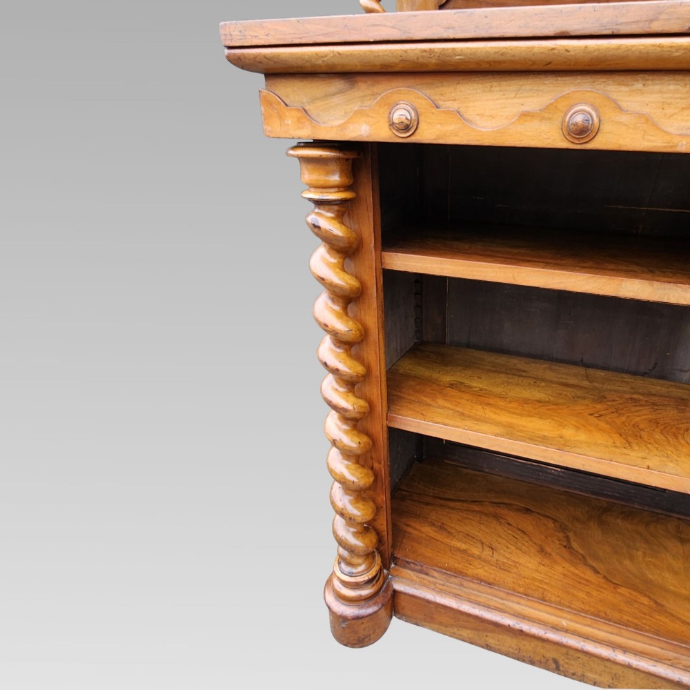 A late Victorian warm brown walnut open buffet sideboard featuring barley twist columns, two upper display shelves, and open base shelving. View VI