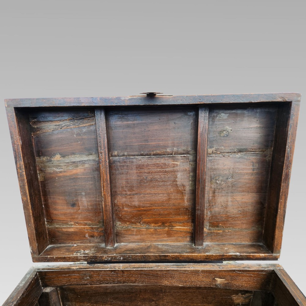 A large antique Chinese wooden storage chest decorated with hand-painted polychrome dragon motifs, floral borders, and brass hardware. View X