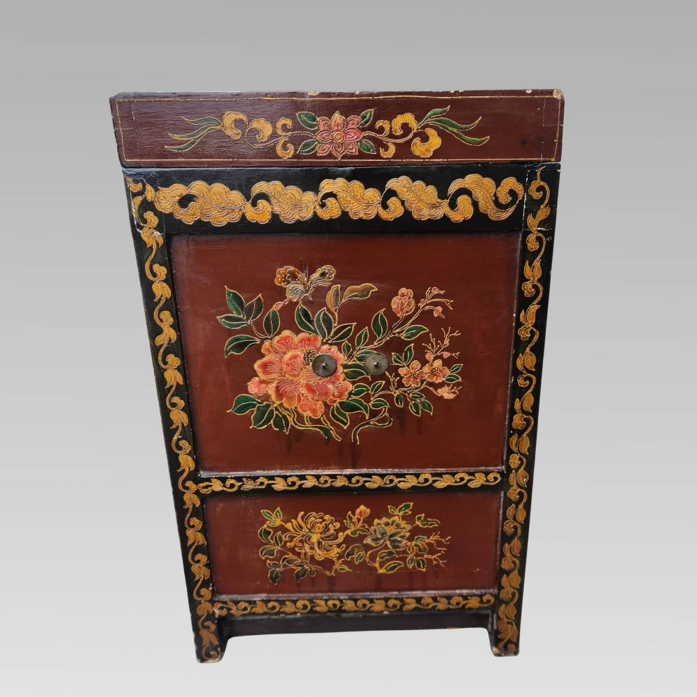 A large antique Chinese wooden storage chest decorated with hand-painted polychrome dragon motifs, floral borders, and brass hardware. View XI