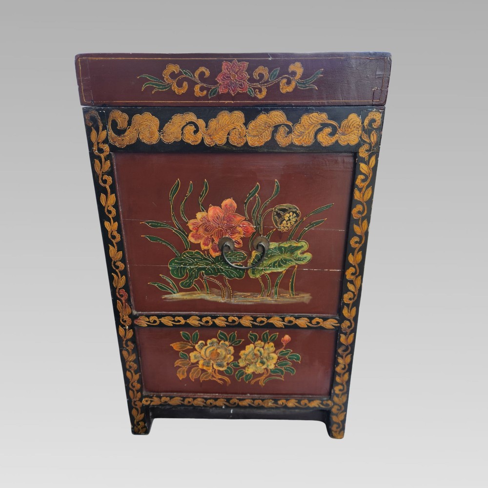 A large antique Chinese wooden storage chest decorated with hand-painted polychrome dragon motifs, floral borders, and brass hardware. View XII