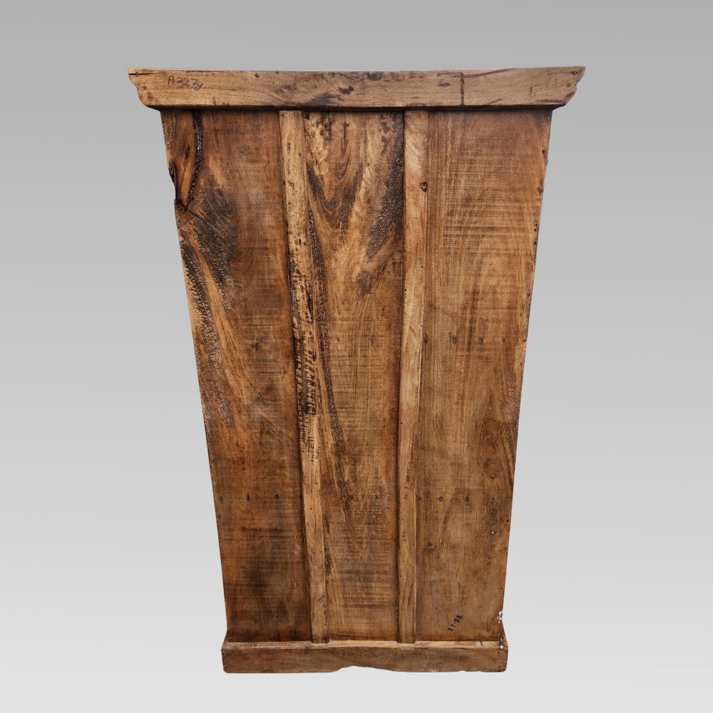 A tall antique Indian cupboard constructed from warm brown reclaimed teak wood with carved frame borders, panelled doors, and rustic iron ring handles. View X
