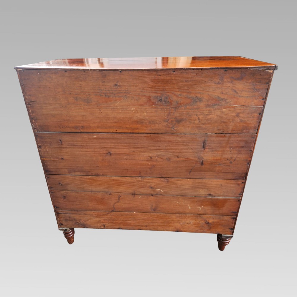 A Victorian mahogany bow-front chest of drawers featuring two short drawers over three long drawers with dark turned handles and turned feet. View XI