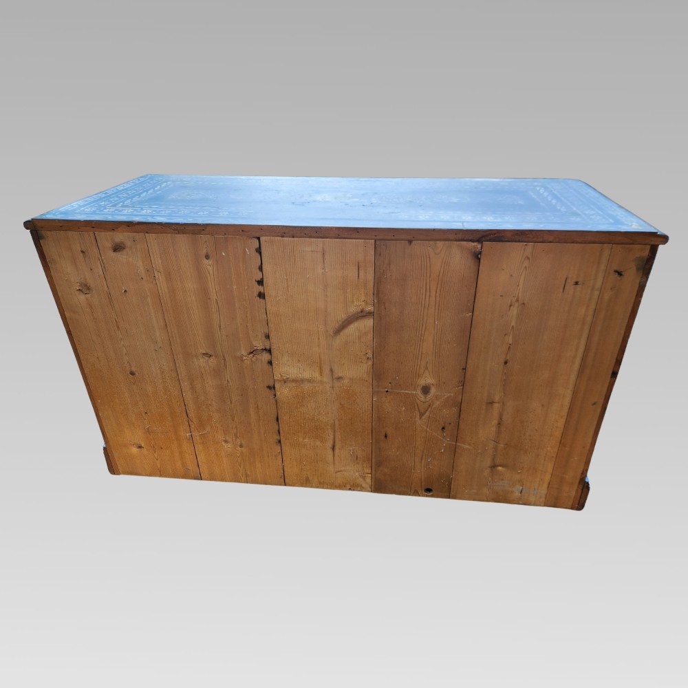 A hand-painted blue pine chest of drawers featuring white elephant motifs and dark metal knob handles. View IV