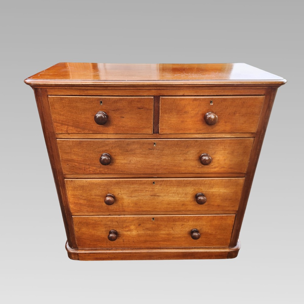 A Victorian mahogany chest of drawers featuring two short drawers above three full-width graduated drawers with turned wooden handles and a plinth base. View II