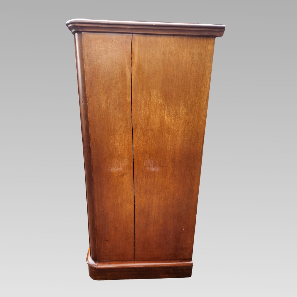 A Victorian mahogany chest of drawers featuring two short drawers above three full-width graduated drawers with turned wooden handles and a plinth base. View VI
